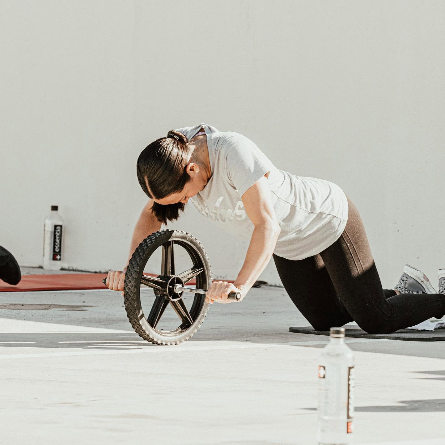 A client working through ab-wheel rollouts one-on-one — South Padre Island residents train at the private 101 Fitness studio in Brownsville