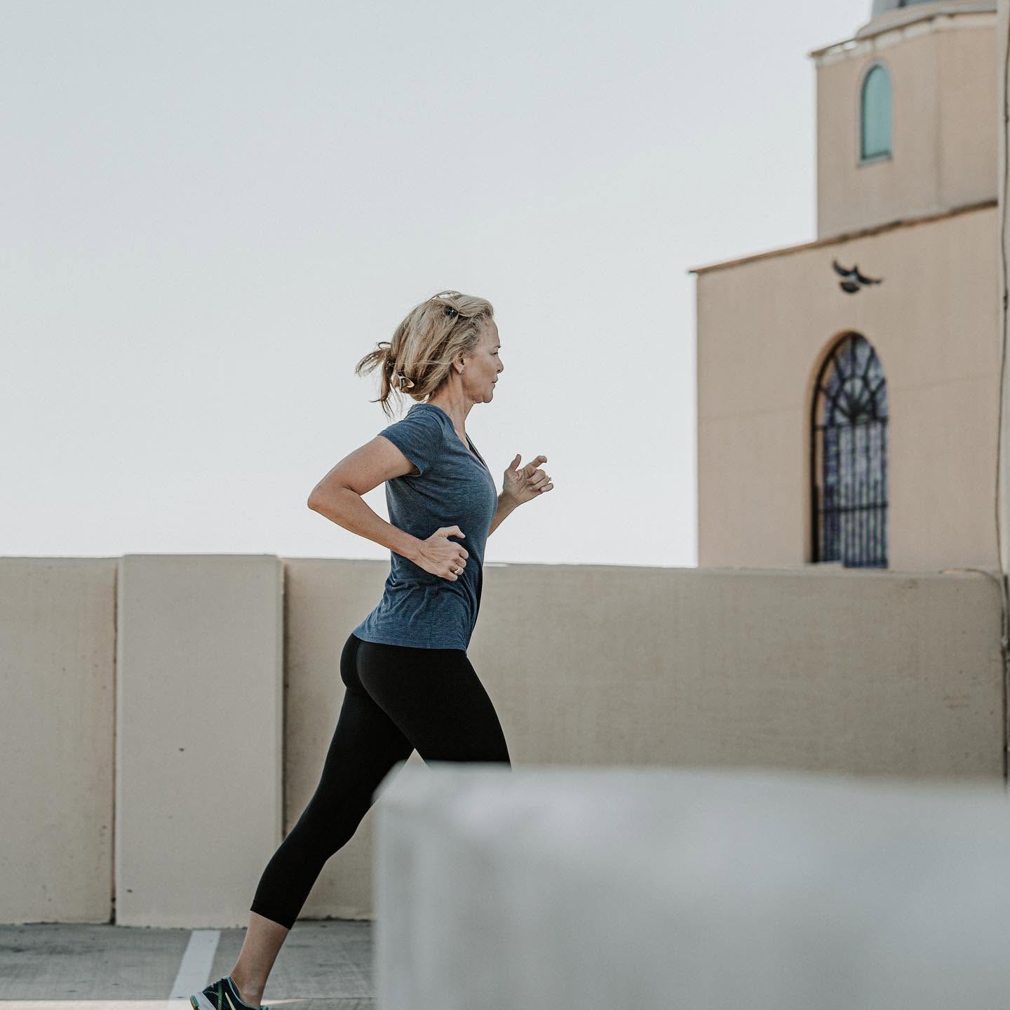 An older adult client jogging at her own pace during a 101 Fitness senior training session in Brownsville, TX