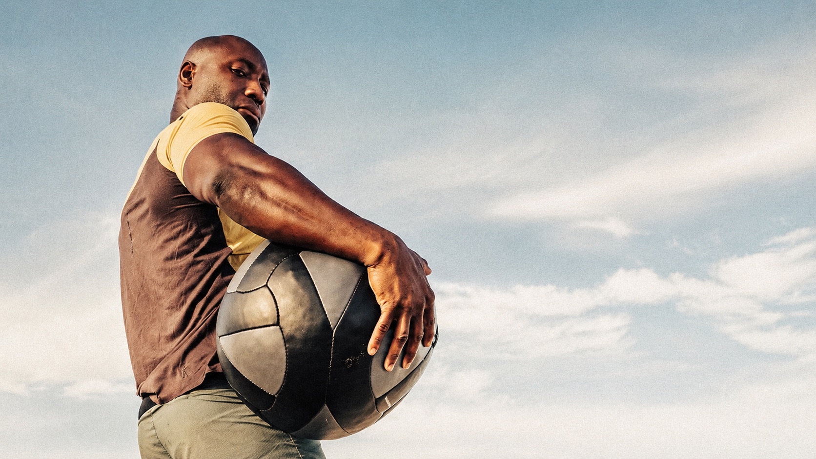 Alex 'Mr. 101' Ampadu, owner of 101 Fitness in Brownsville, under an open South Texas sky